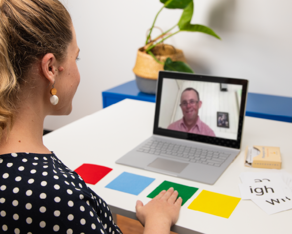 Speech Therapist and Down Syndrome Client completing a speech language pathology session via telehhealth